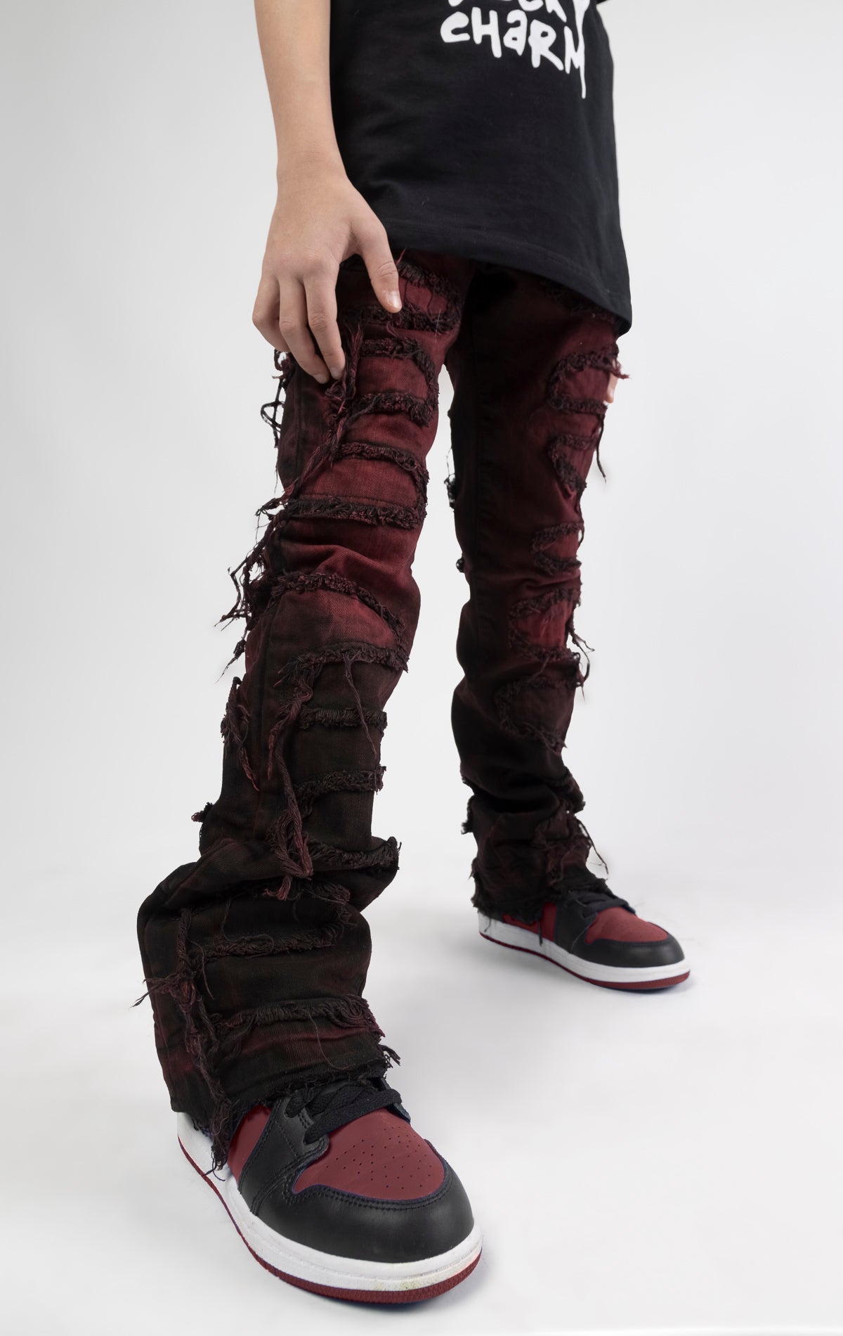 Skinny fit Regular rise denim with extended length for maximum stacks. Magma ombre wash with rip and repair design featuring self fabric backing. Patches and abrasions throughout for a trendy and edgy look.