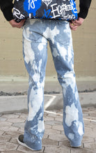 Indigo stacked flare jeans with a bleach wash finish