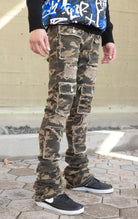 Camo super stacked jeans featuring an extra-long inseam and flared leg opening with distressing, stone washing and frays.