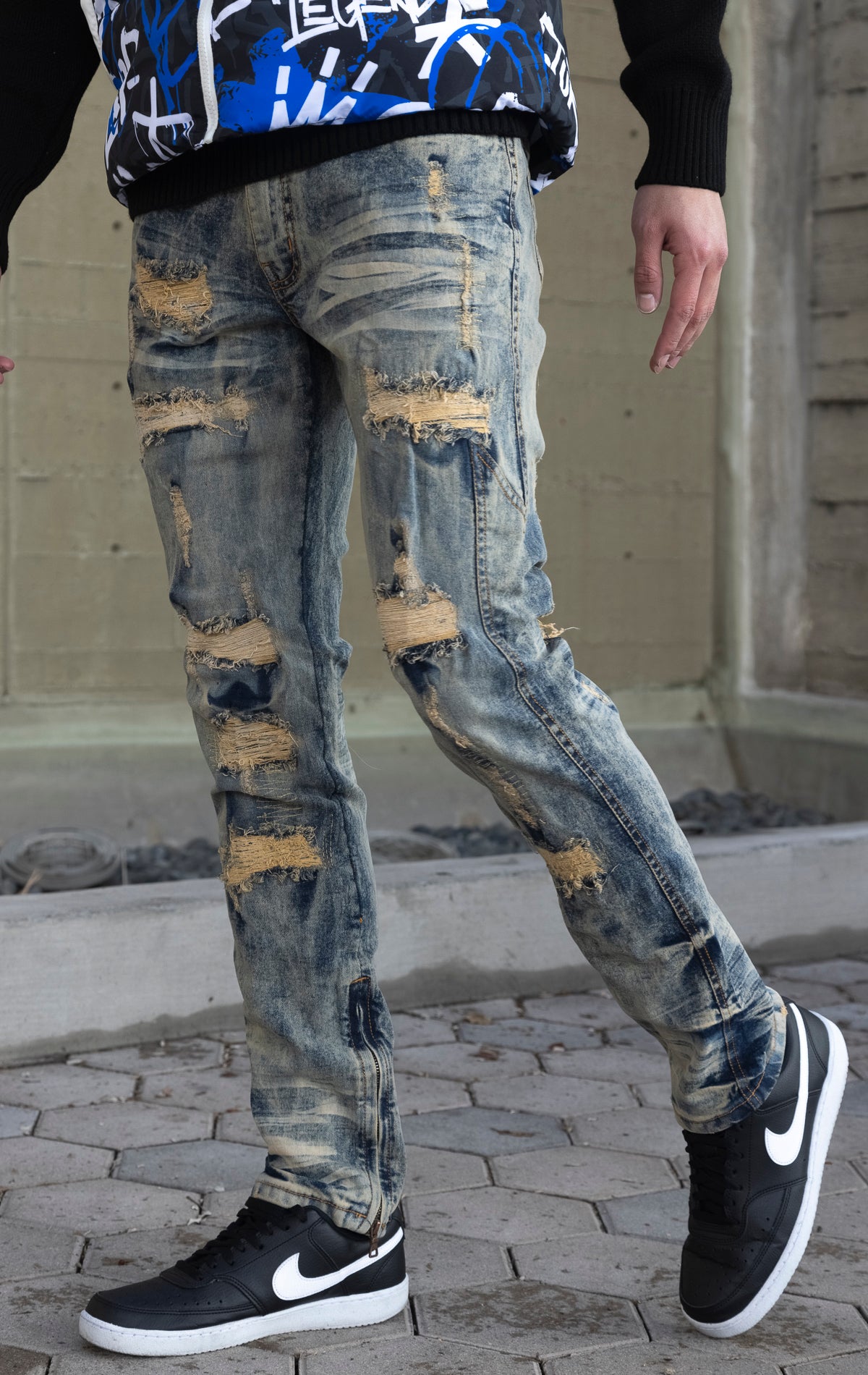 Light tint Stacked rip and repair styled denim.
