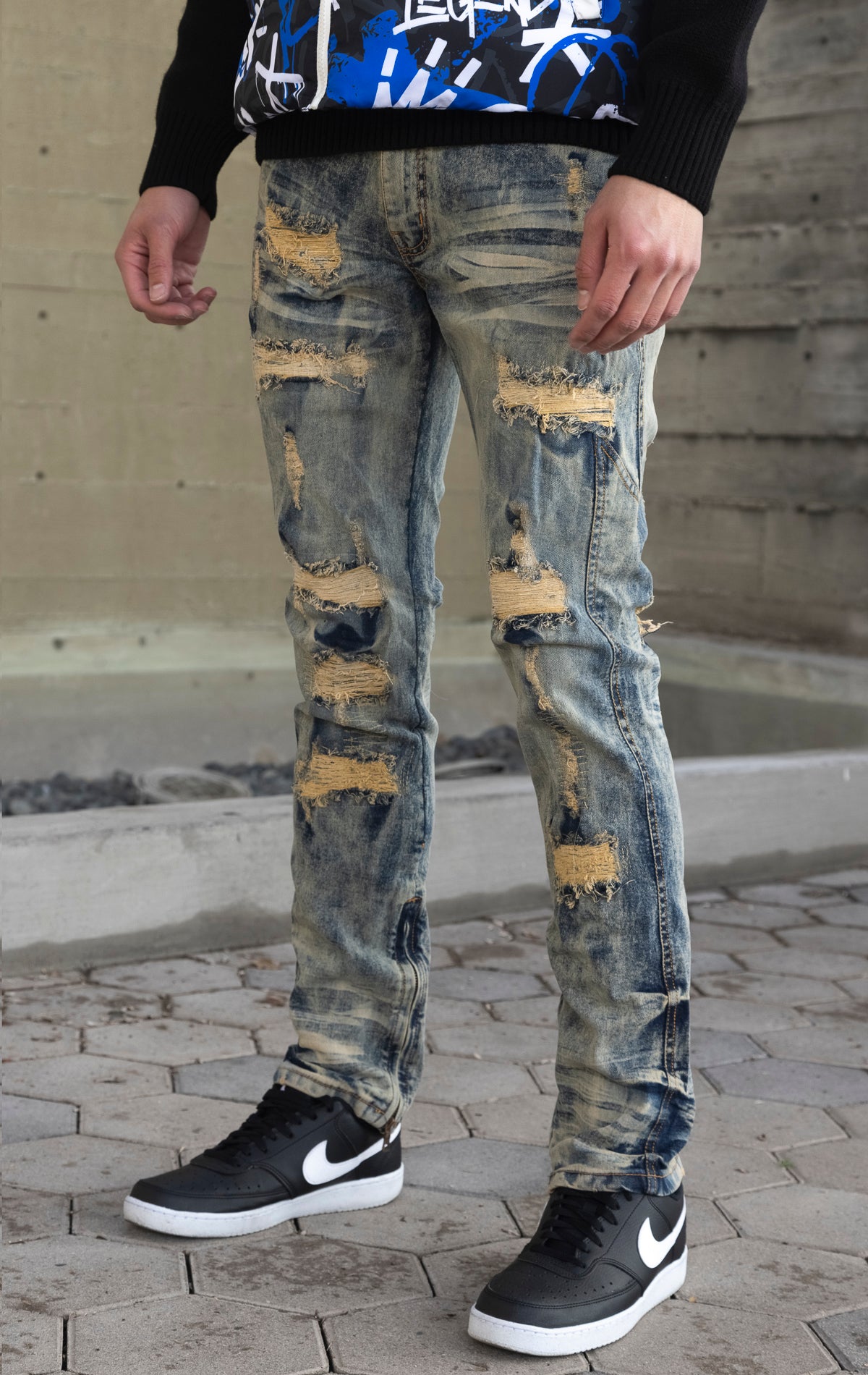 Light tint Stacked rip and repair styled denim.