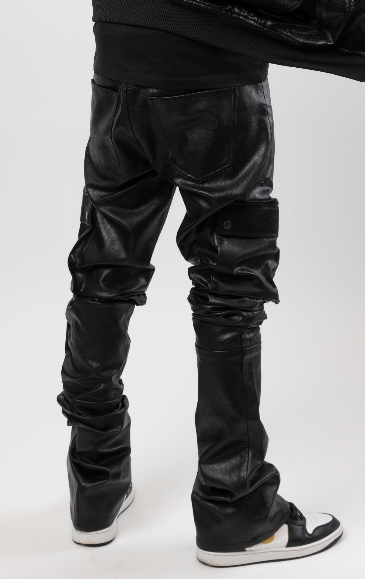 stacked Leather Doctrine Carter jeans with an extra-long inseam and flared leg opening, complete with side and back pockets.
