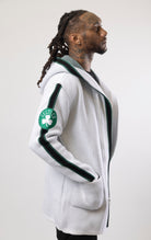 Upgrade your game day look with this Boston Celtics Cardigan Sweater. This cozy jacket is designed with a stylish three-quarter length and boasts bold team branding on the front, back, and sleeve. Complete with a full-zip closure, attached hood, and front pockets, this knit sweater offers both comfort and style.