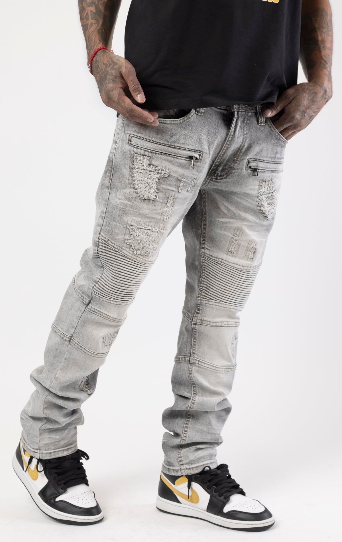 Gray high-quality denim made from 98% cotton and 2% spandex. With its rip and repair design and slim fit, it's the ultimate blend of style and comfort.