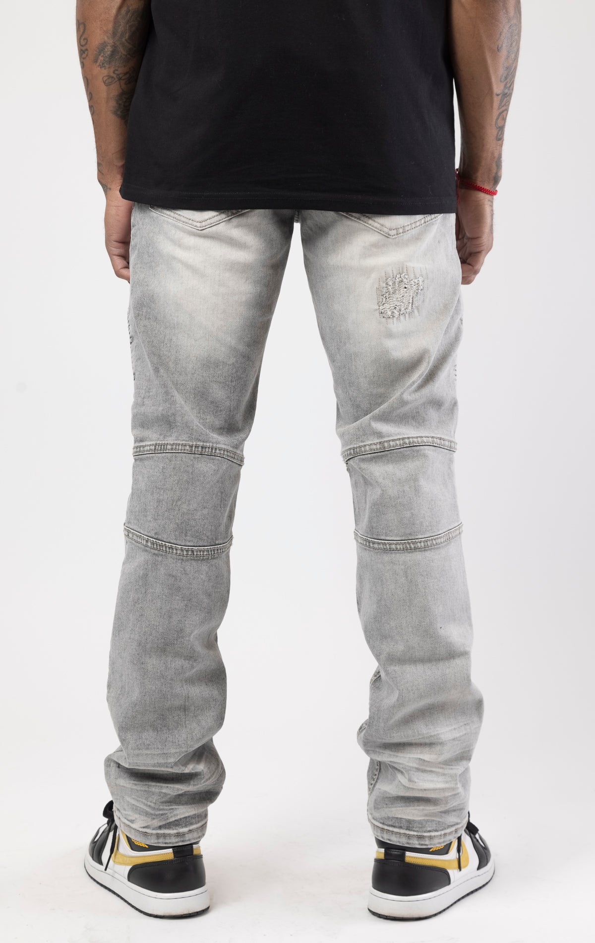 Gray high-quality denim made from 98% cotton and 2% spandex. With its rip and repair design and slim fit, it's the ultimate blend of style and comfort.