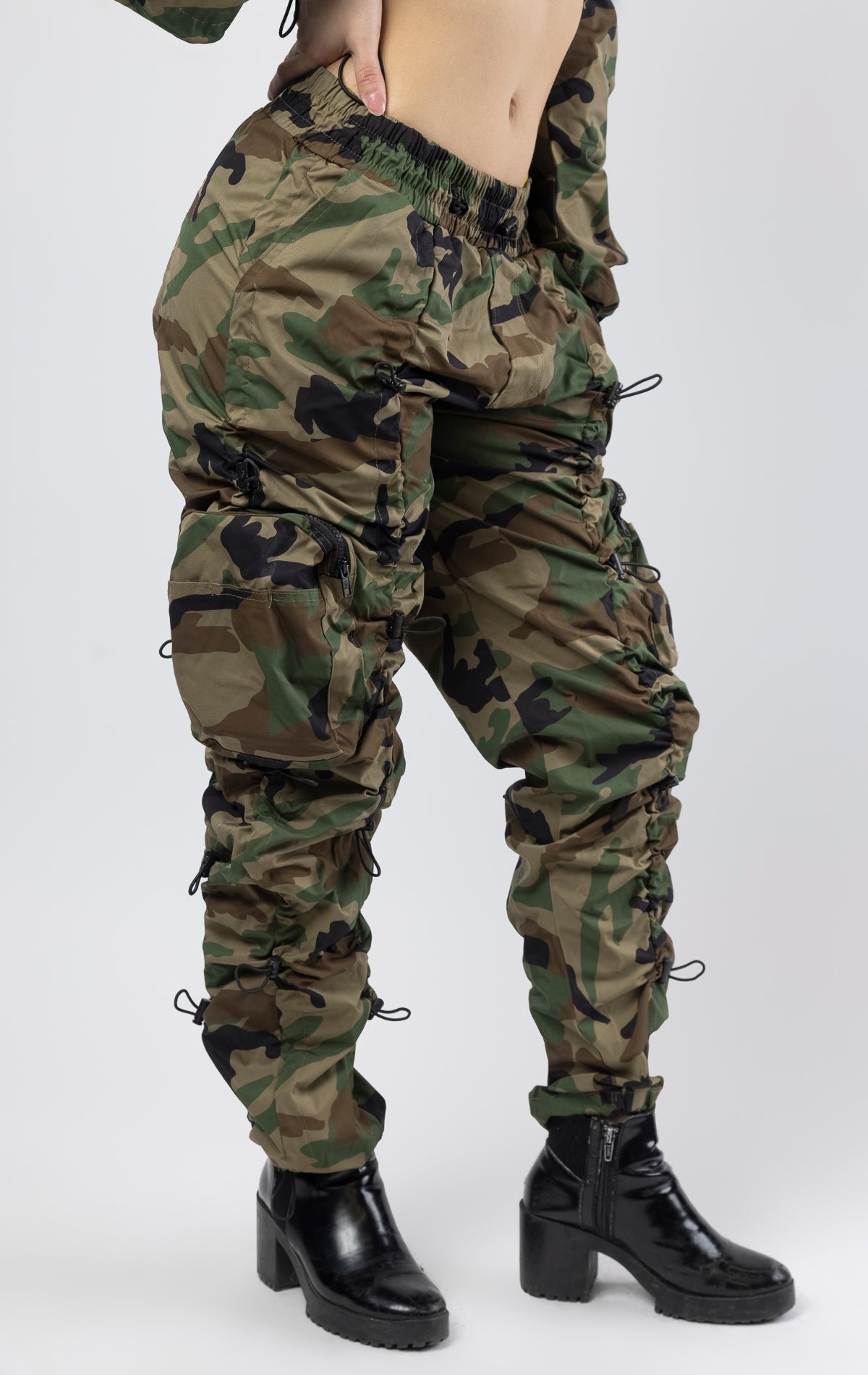 Wood Camo multi-bungee jogger featuring a Brook fit, snap buttons, an adjustable waist and wide pockets.