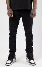 Jet black rip and repair denim pants