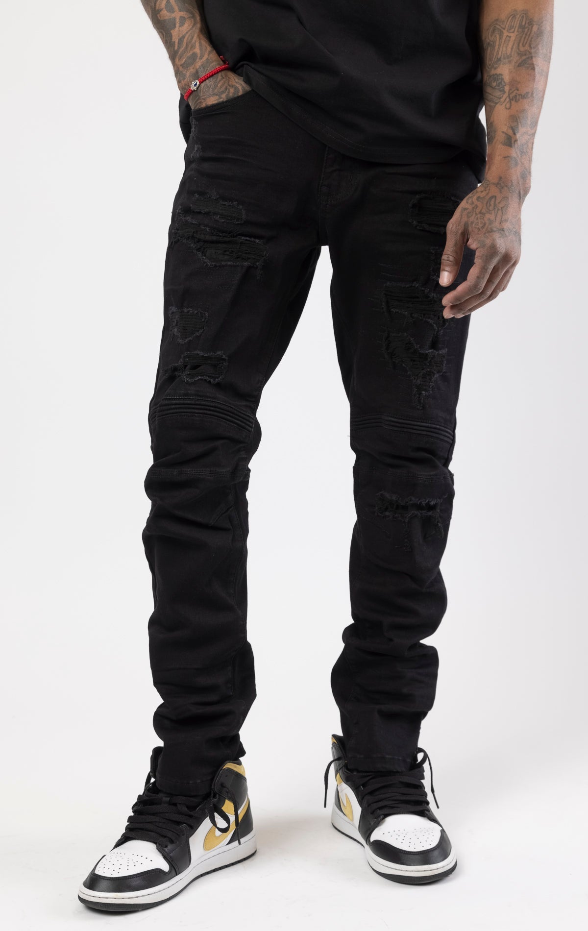 Jet black rip and repair denim pants