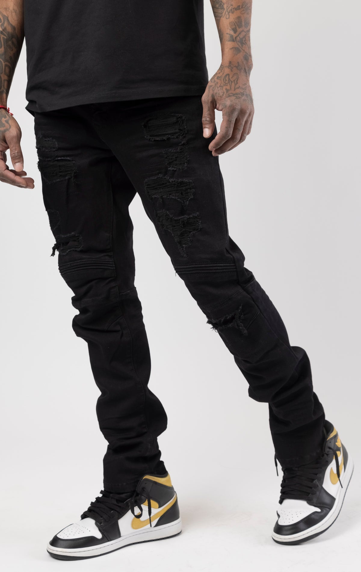 Jet black rip and repair denim pants