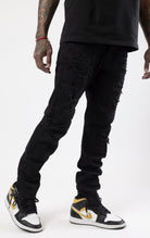 Jet black rip and repair denim pants