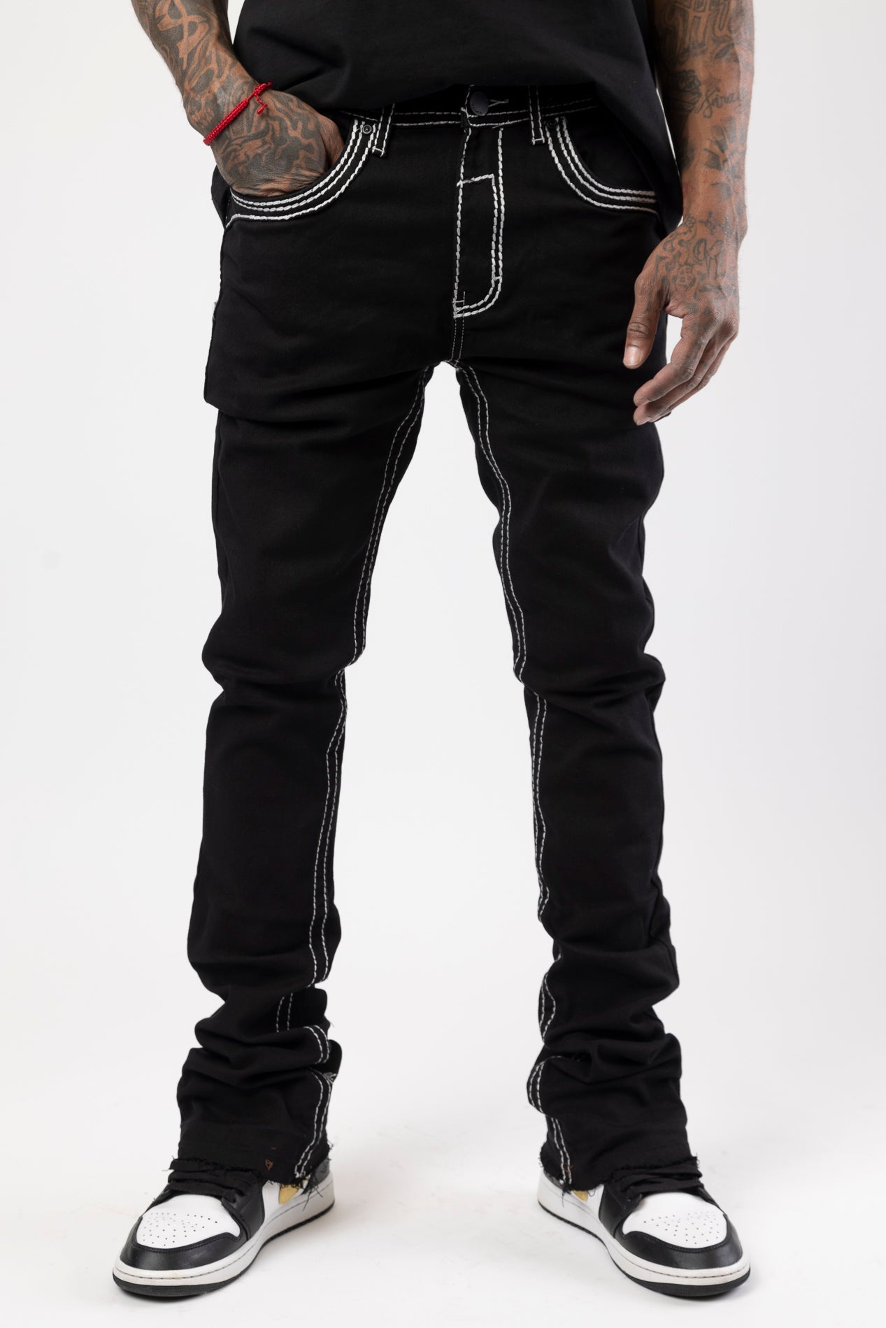 Stacked jeans with bold stitching details and flared bottom leg.