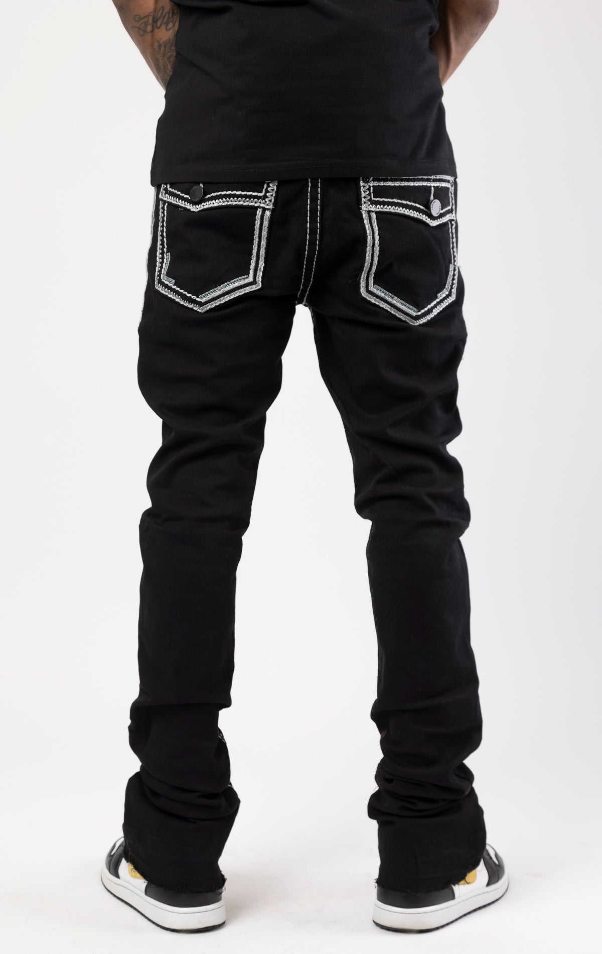 Stacked jeans with bold stitching details and flared bottom leg.