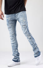 Our Slim Taper Fit, Comfort fit from waist to thigh, Regular rise waist, Tight but comfortable tapering from knee to ankle - the perfect combination. Rip and repair design with raw denim backing and hanging weft adds a unique touch, while the distressed l