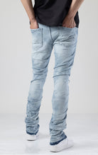 Our Slim Taper Fit, Comfort fit from waist to thigh, Regular rise waist, Tight but comfortable tapering from knee to ankle - the perfect combination. Rip and repair design with raw denim backing and hanging weft adds a unique touch, while the distressed l