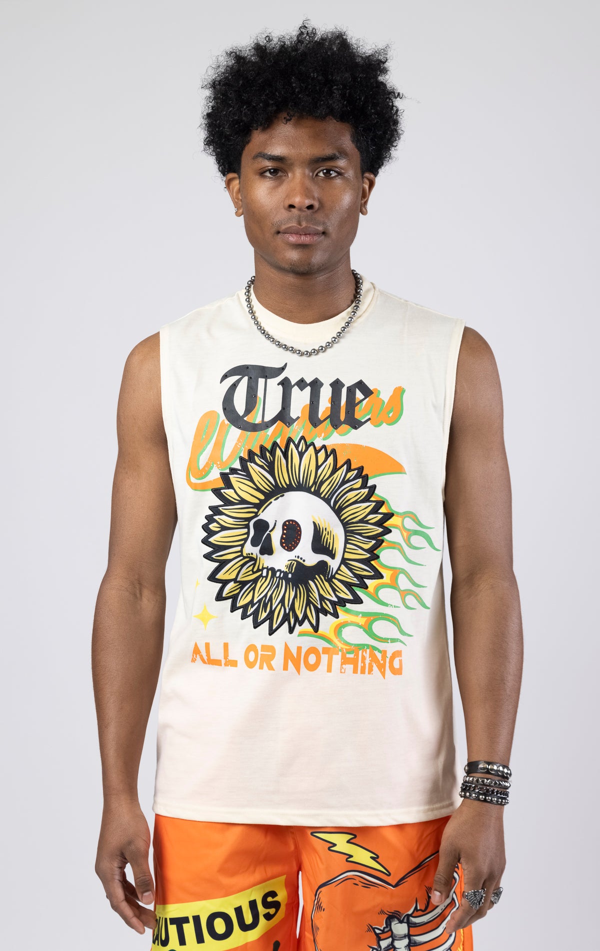 Creme Sleeveless crew neck tank top with a printed graphic.