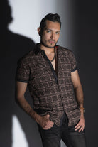 Men's casual, relaxed-fit button-down shirt with a short sleeve design. The shirt features an all-over Greek key pattern and a front button closure.