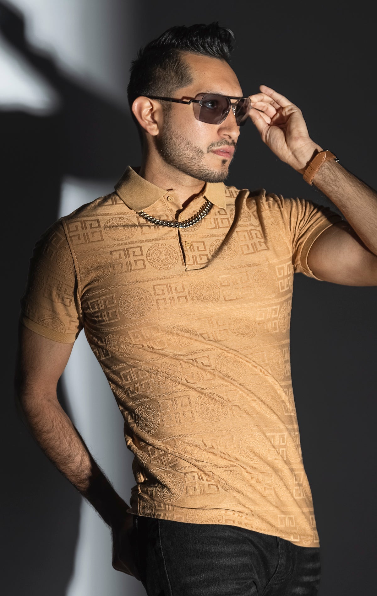 Khaki Men's regular-fit, short-sleeve polo shirt. The shirt features a seamless Greek pattern and a classic polo design