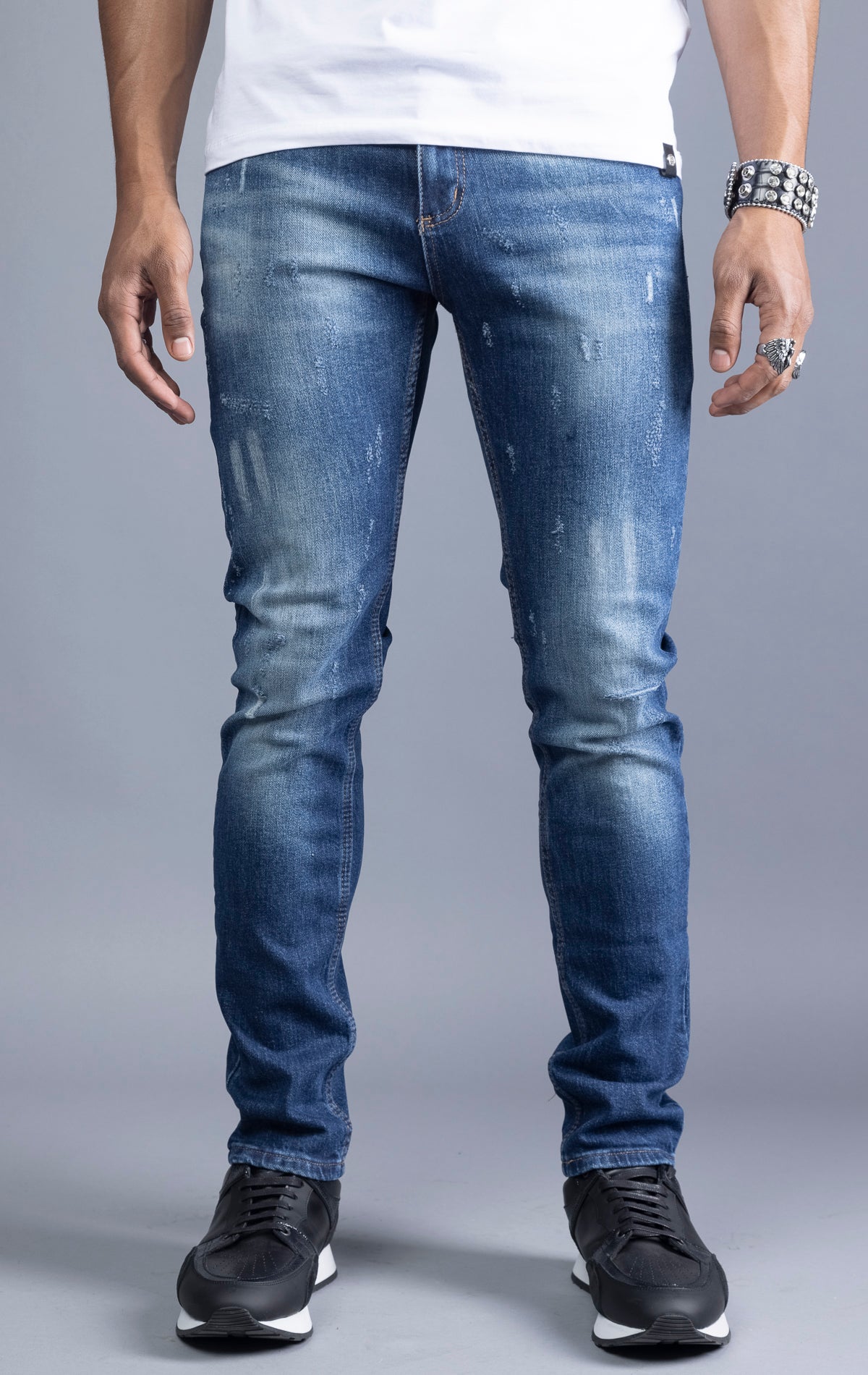 Men's  blue slim-fit jeans made from 98% cotton and 2% Lycra®. The jeans are machine washable and available in all sizes with a 34-inch inseam.