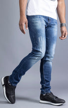 Men's blue slim-fit jeans made from 98% cotton and 2% Lycra®. The jeans are machine washable and available in all sizes with a 34-inch inseam.