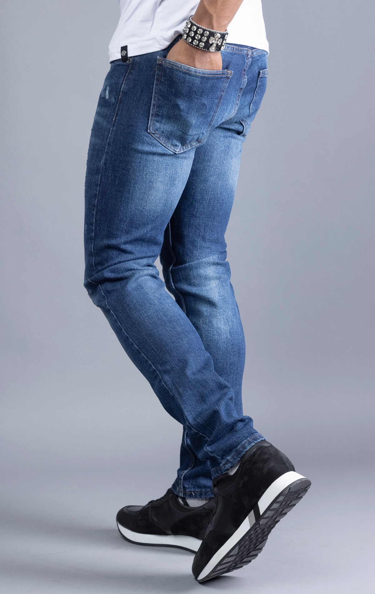 Men's blue slim-fit jeans made from 98% cotton and 2% Lycra®. The jeans are machine washable and available in all sizes with a 34-inch inseam.