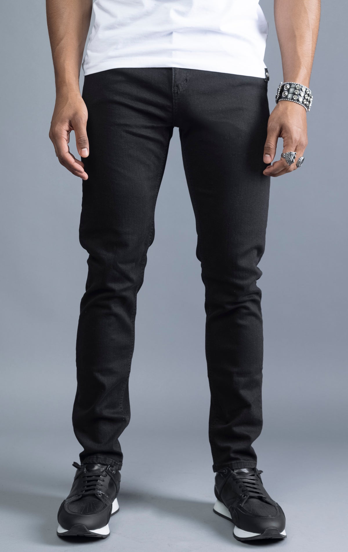 Men's black slim-fit jeans made from 98% cotton and 2% Lycra®. The jeans are machine washable and available in all sizes with a 34-inch inseam.