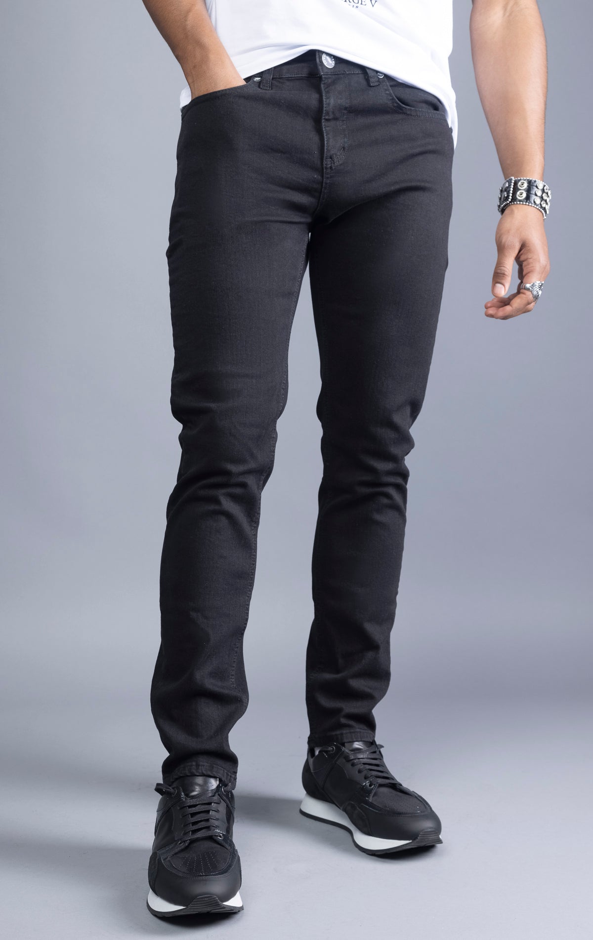 Men's black slim-fit jeans made from 98% cotton and 2% Lycra®. The jeans are machine washable and available in all sizes with a 34-inch inseam.