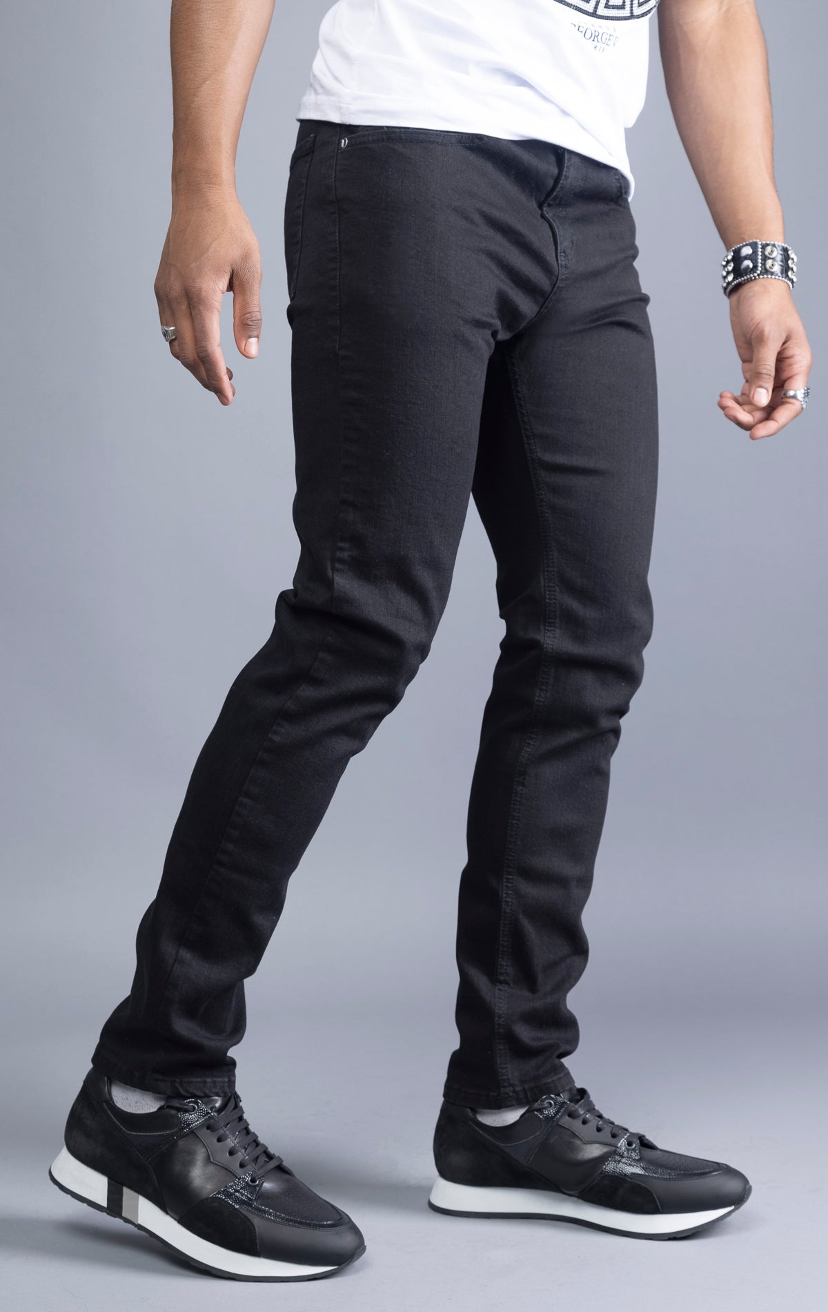 Men's black slim-fit jeans made from 98% cotton and 2% Lycra®. The jeans are machine washable and available in all sizes with a 34-inch inseam.