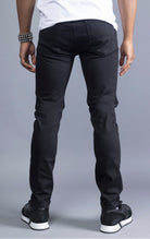 Men's black slim-fit jeans made from 98% cotton and 2% Lycra®. The jeans are machine washable and available in all sizes with a 34-inch inseam.