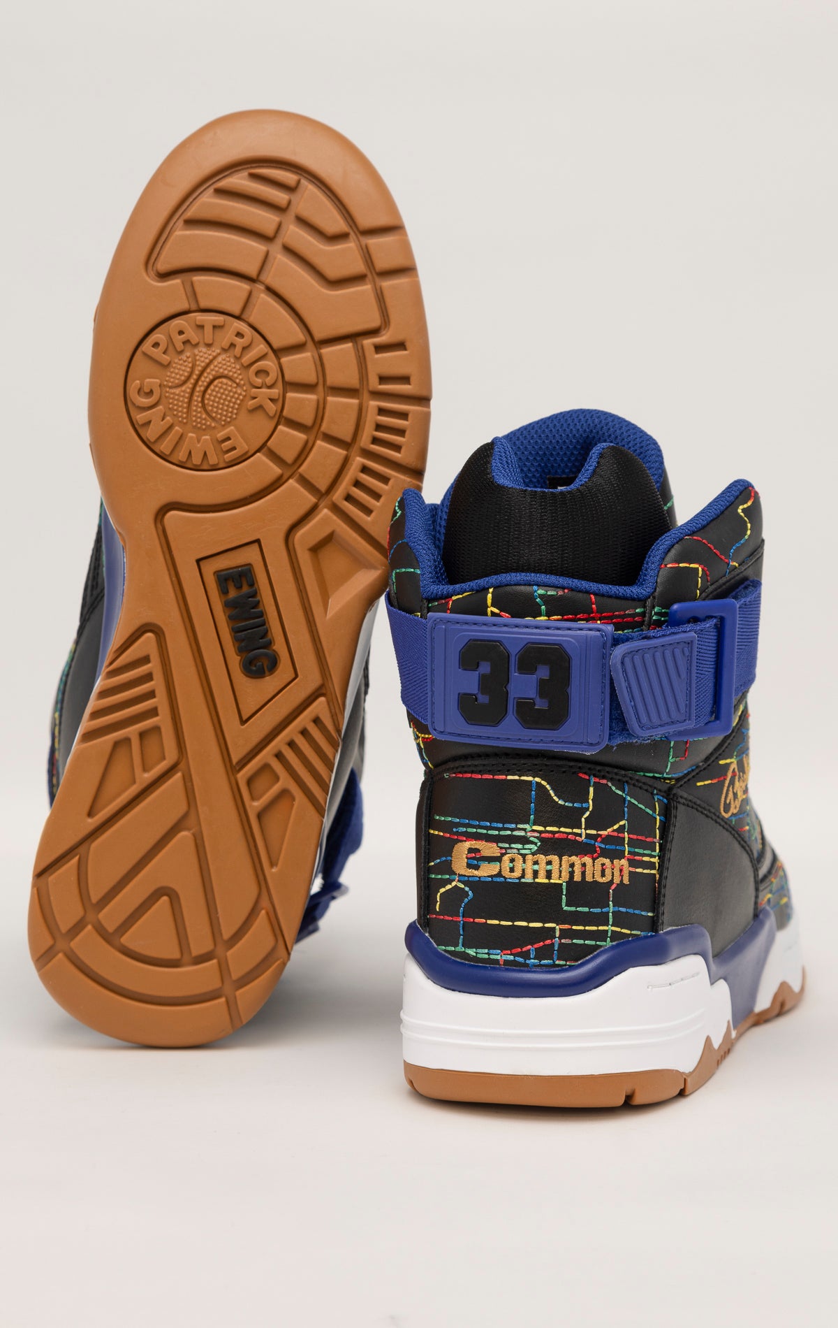 Multi high-top sneakers by Ewing Athletics with a collaboration with rapper Common. Features a cartoon graphic on the side and multicolored accents.