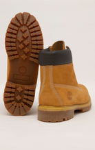 Timberland 6-Inch boots in premium wheat nubuck leather with waterproof construction, padded collar, and lug outsole