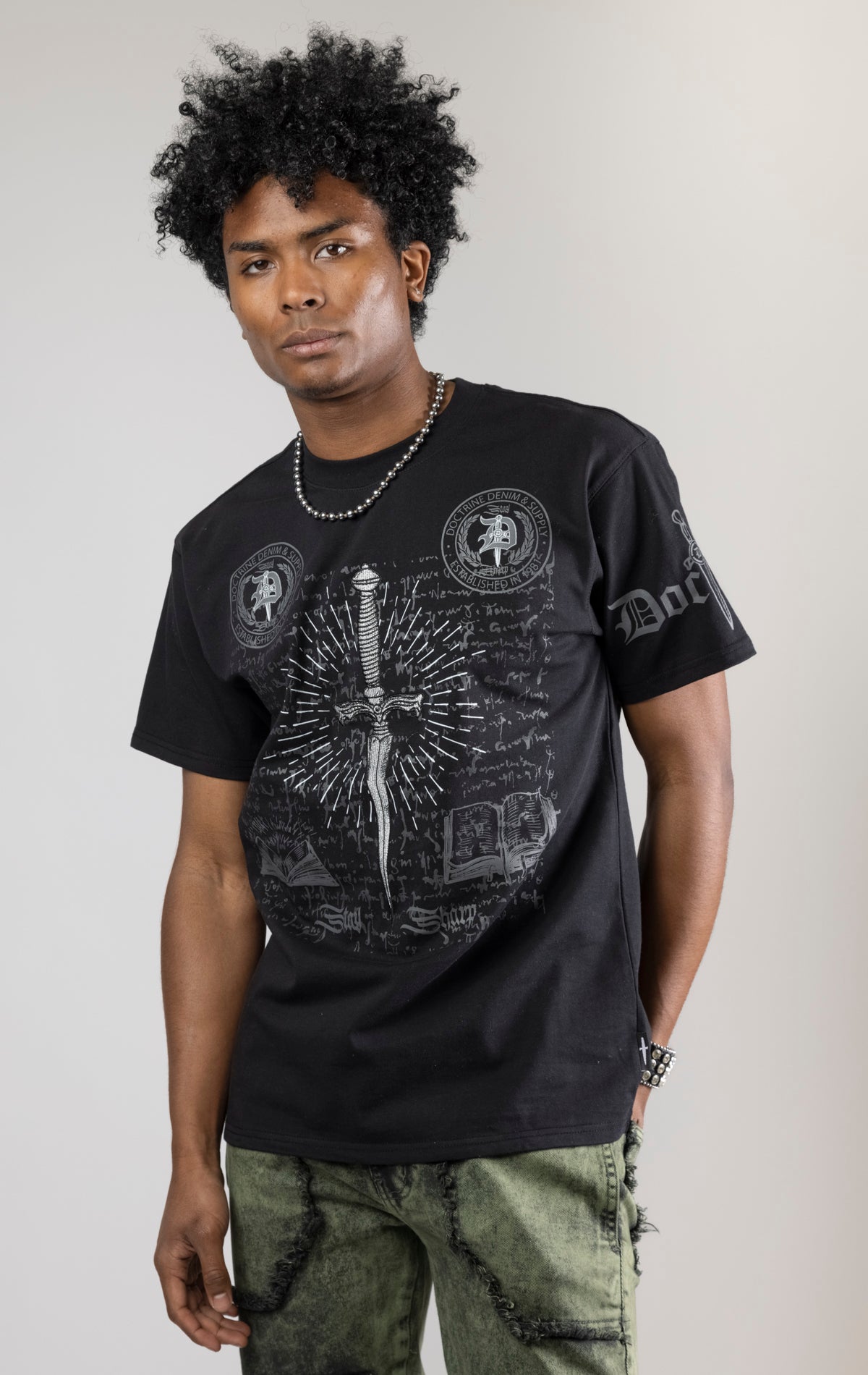 black CORE DAGGER vintage graphic t-shirt. The shirt is made from 100% cotton with a vintage wash and features a high-definition digital graphic on the front.