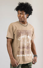 A DOCTRINE STRIKE BACK T-shirt featuring a high-definition digital graphic print across the front. The shirt is made from 100% cotton and has a vintage-washed look.