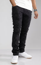 Stacked Skinny Pants in Stretch Twill in black. Made from a comfortable stretch twill fabric for all-day comfort. Features a skinny fit with a stacked design, perfect for creating a trendy cuffed look without extra effort