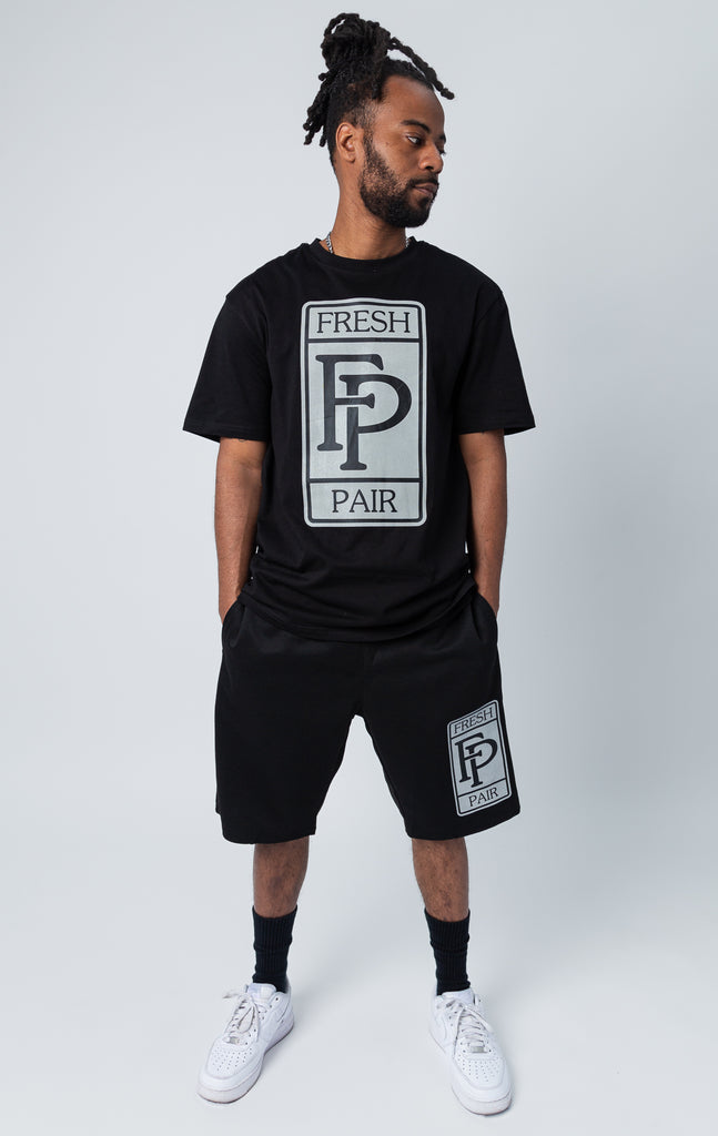 Black set of shirt and shorts with "fresh pair" graphic print