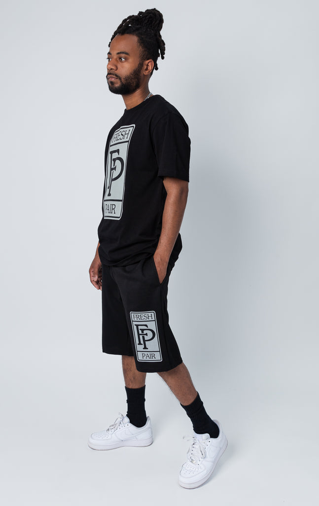 Black set of shirt and shorts with "fresh pair" graphic print