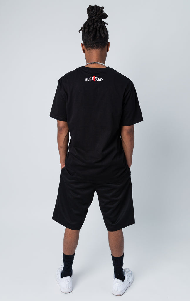 Back side of black set of shirt and shorts with "fresh pair" graphic print