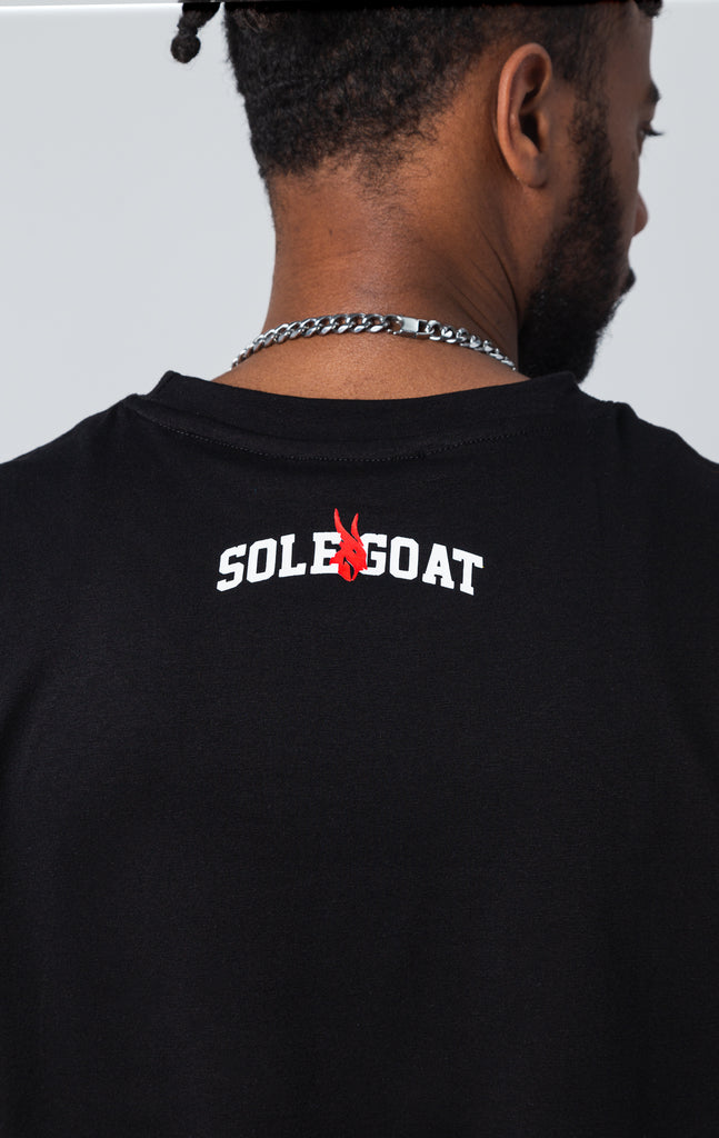 Sole goat logo on top back of shirt