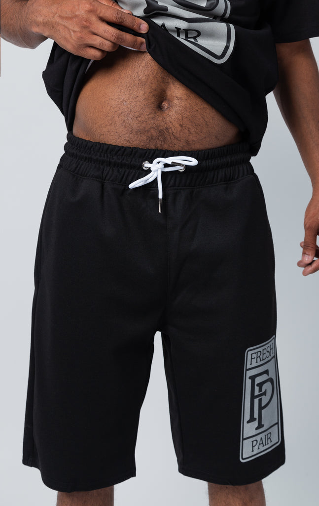 Black shorts with "fresh pair" graphic on left leg