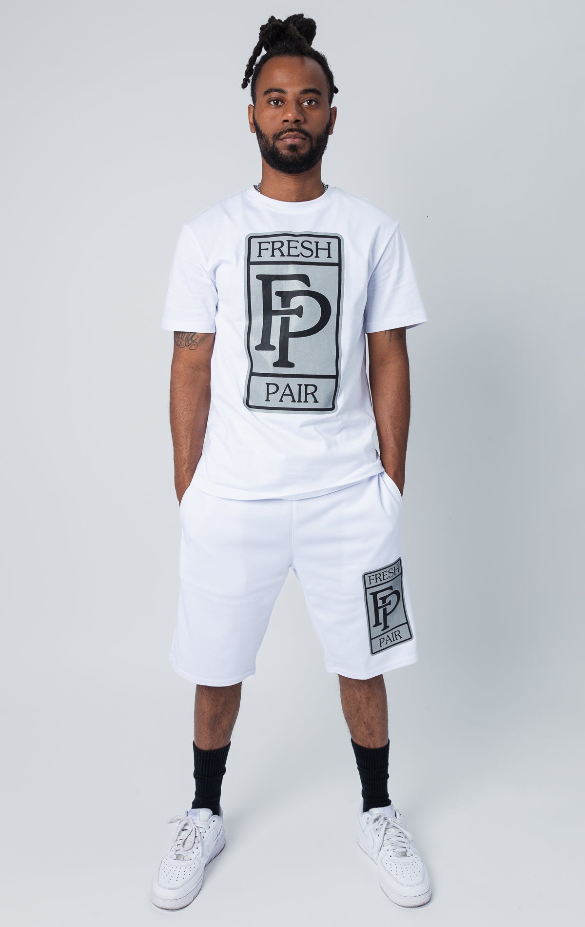 White set of shirt and shorts with "fresh pair" graphic print