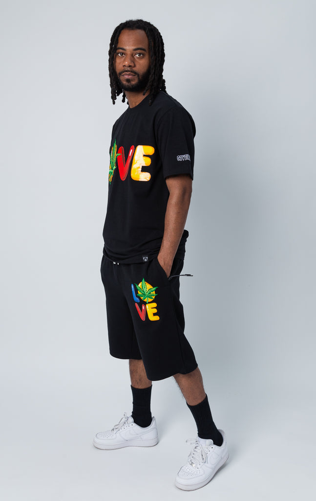 Black set of shirt and shorts with "LOVE" graphic.