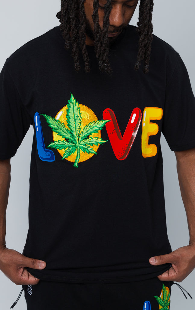 Black set of shirt and shorts with "LOVE" graphic.