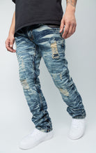 Blue ripped low-waisted slim jeans.
