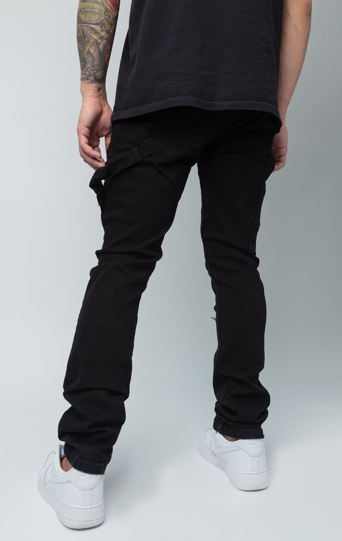 Fixed waist ripped cargo style black jeans.