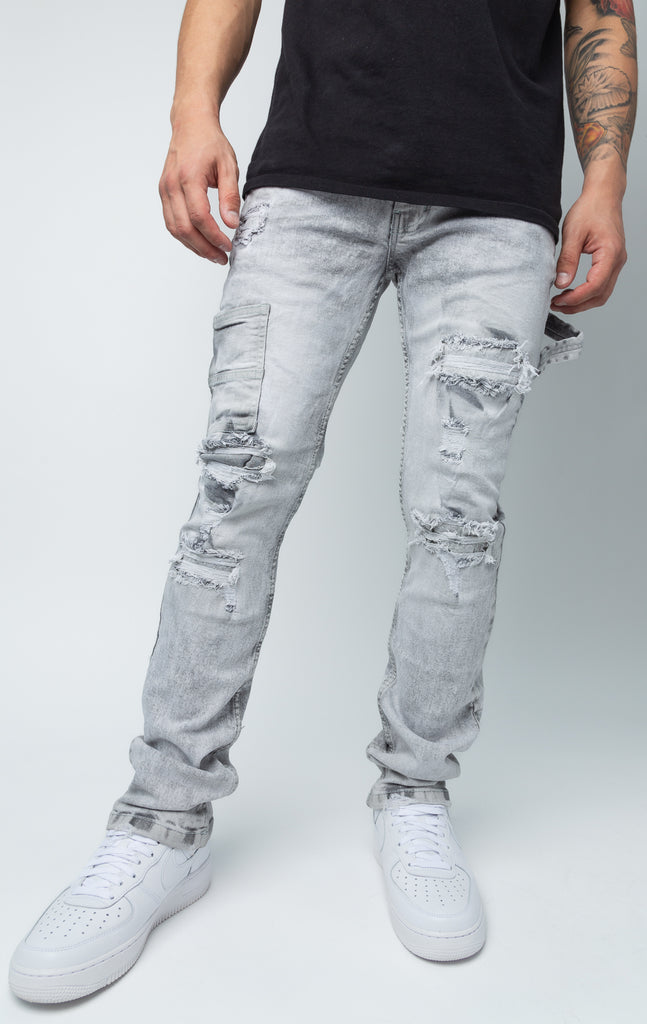 Fixed waist ripped cargo style grey jeans.