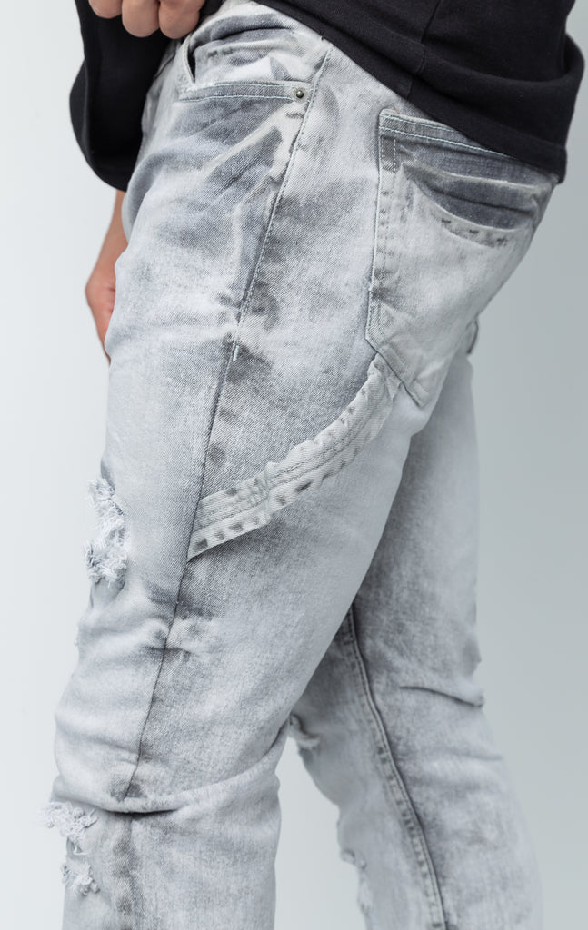 Fixed waist ripped cargo style grey jeans.