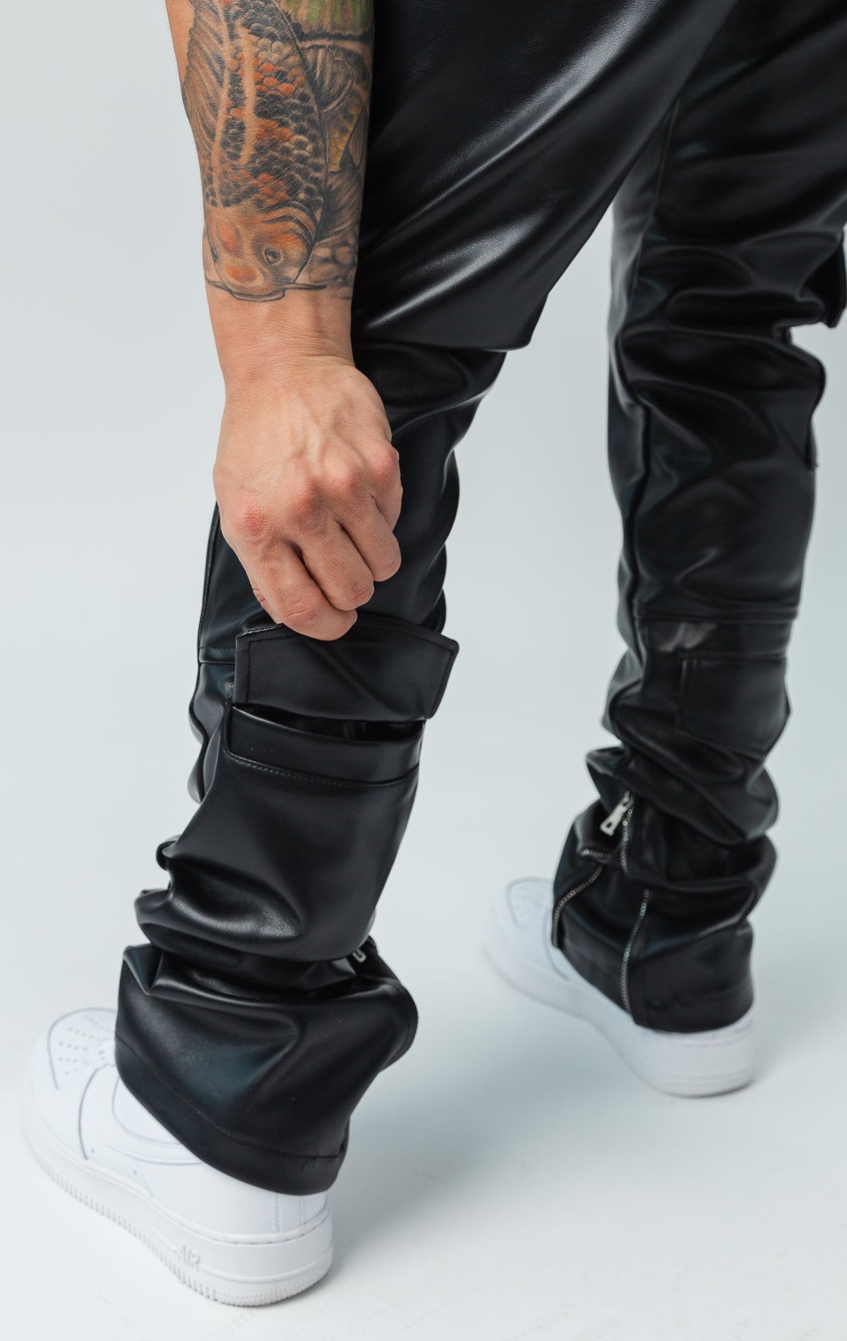 Stretch faux black leather biker pants. Slim fit.