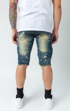 Light tinted distressed denim shorts