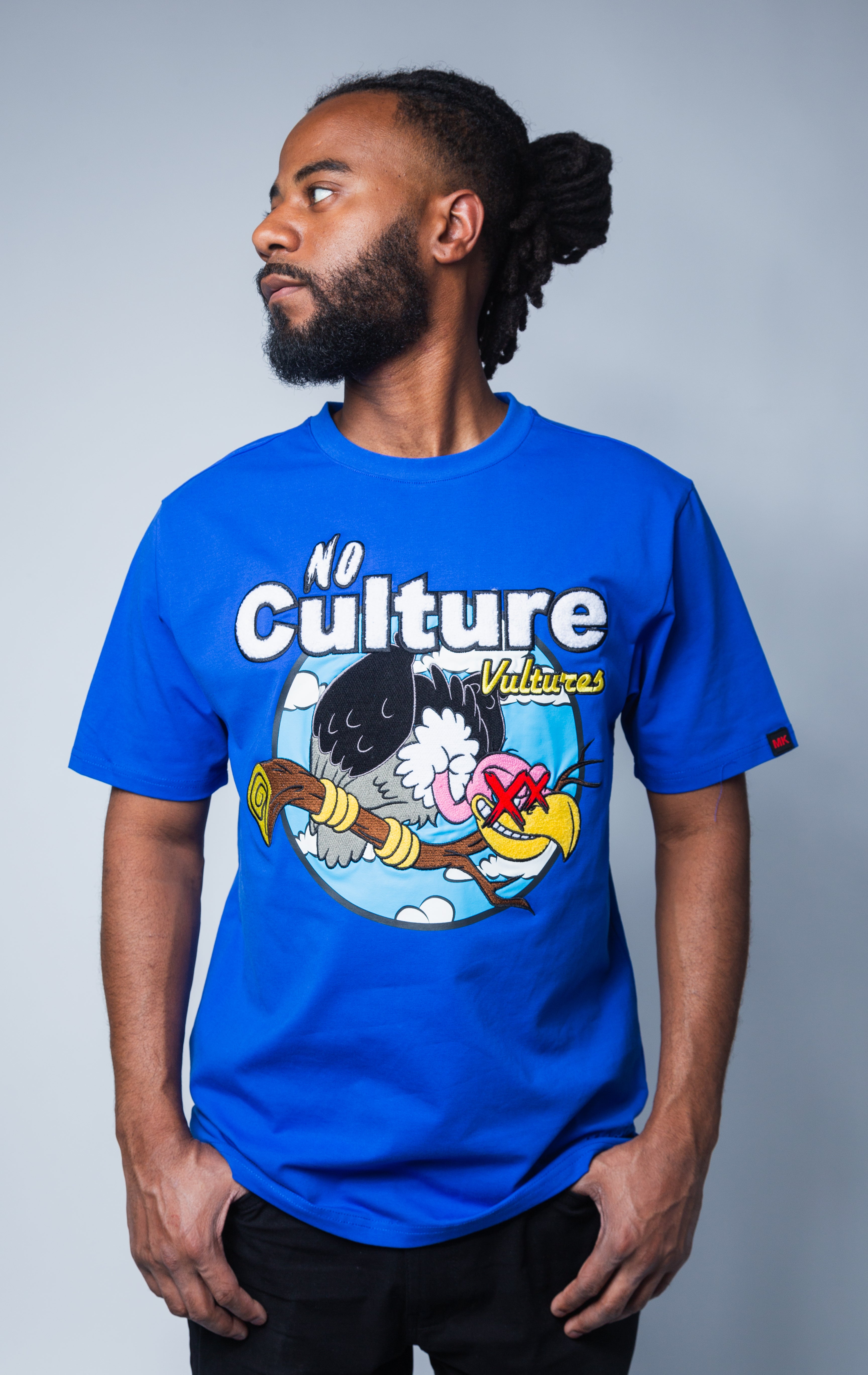 Royal blue t-shirt with No Culture Vulture graphic on front