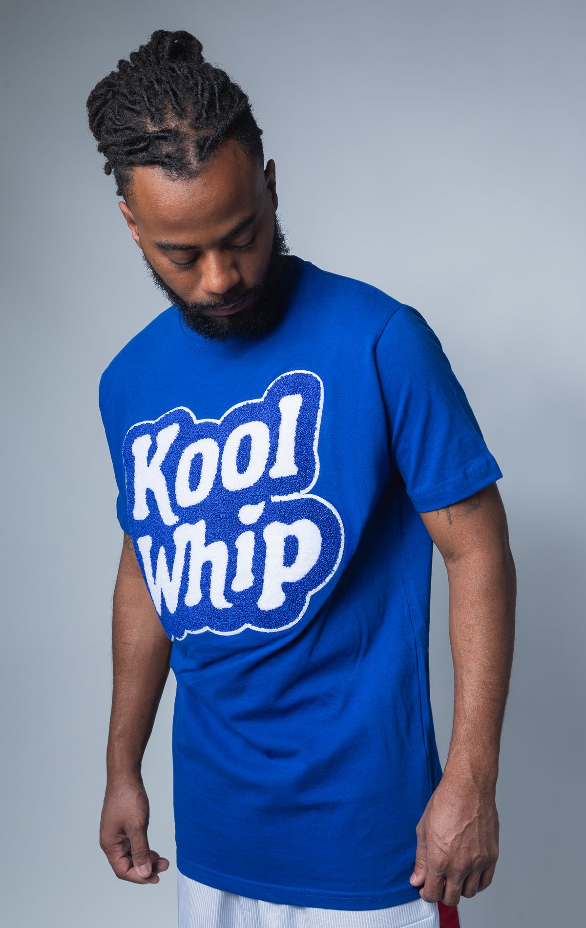 Blue Kool Whip t shirt featuring a chenille applique and ribbed trim