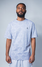 grey all-over tonal embossed pattern, short sleeve t-shirt with logo hardware on left side of chest